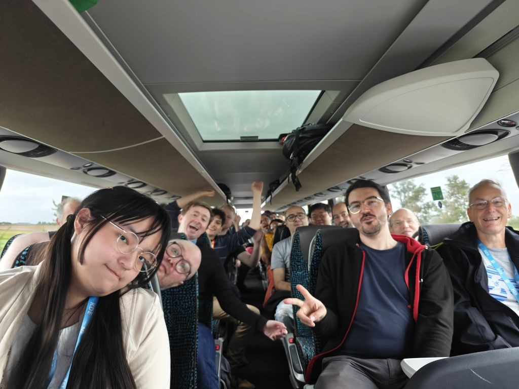 Group photo of attendees in the bus going to visit Rothenburg ob der Tauber 