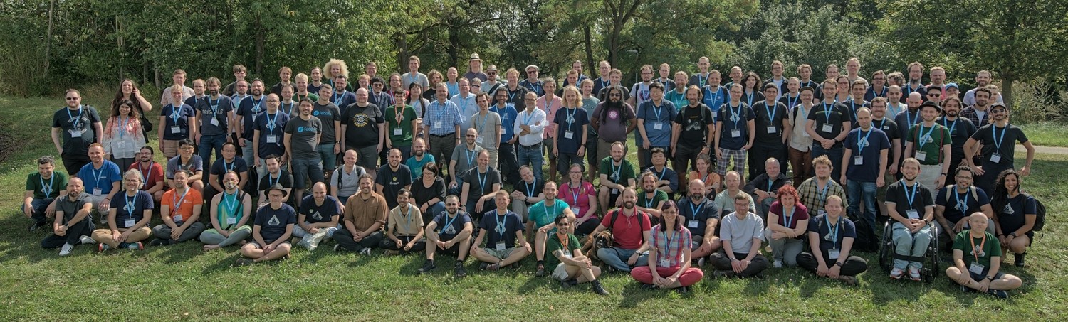 Akademy 2024  attendees pose for the event group photo.